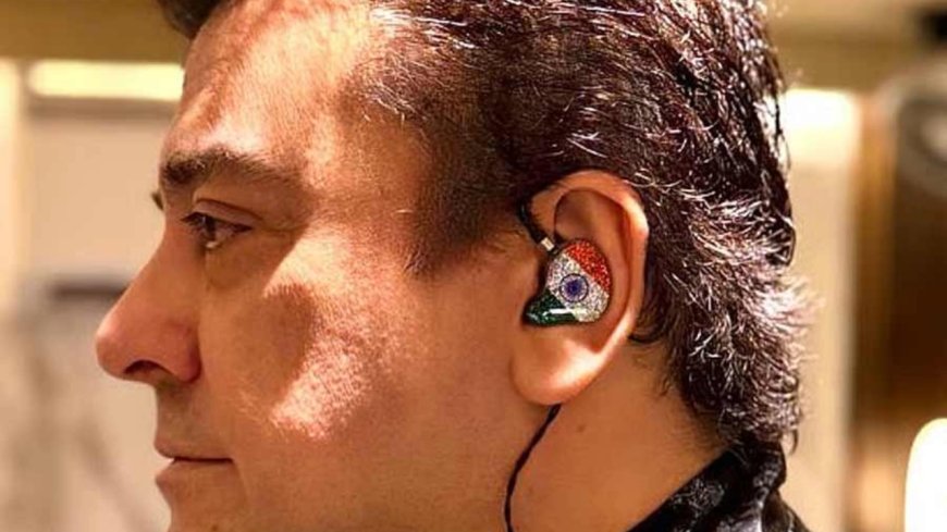 Adnan Sami wearing a tricolor device in his ear